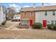 Charming townhome with a red front door, brick facade, tidy landscaping, and a welcoming feel at 407 Paper Mill Lndg, Roswell, GA 30076