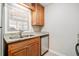 A bright kitchen featuring stainless steel dishwasher and granite countertops at 407 Paper Mill Lndg, Roswell, GA 30076