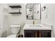 Modern bathroom featuring a marble countertop, gold faucet, and sleek black and white design elements at 56 Ruth Way, Douglasville, GA 30134