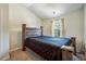 Bedroom featuring a wooden bed frame, carpet, and lots of natural light at 56 Ruth Way, Douglasville, GA 30134