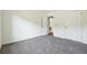 Bedroom featuring neutral carpet, white walls, and two closet doors at 56 Ruth Way, Douglasville, GA 30134