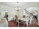 Formal dining room featuring coffered ceiling, modern chandelier, and stylish furnishings at 56 Ruth Way, Douglasville, GA 30134