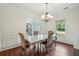 Elegant dining room with natural lighting, coffered ceiling, and sophisticated decor at 56 Ruth Way, Douglasville, GA 30134