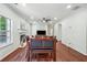 Spacious living room featuring a fireplace, ceiling fan, and open concept to the dining area at 56 Ruth Way, Douglasville, GA 30134