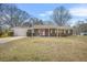 Charming single story home with a brick facade, attached garage, and well-manicured front lawn at 897 Marie Lane Sw Ln, Conyers, GA 30094