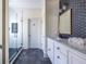 Modern bathroom featuring a glass shower and decorative wall mirror at 944 Cherokee Se Ave, Atlanta, GA 30315