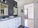 Modern bathroom with dual sinks, decorative mirrors, and adjacent room at 944 Cherokee Se Ave, Atlanta, GA 30315