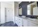 Modern bathroom with dual sinks, decorative mirrors, and great storage at 944 Cherokee Se Ave, Atlanta, GA 30315