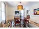 Dining room featuring a wooden table, hardwood floors, and stylish window treatments at 944 Cherokee Se Ave, Atlanta, GA 30315