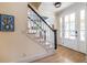 Inviting entryway with hardwood floors, staircase, and front door at 944 Cherokee Se Ave, Atlanta, GA 30315