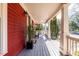 Spacious front porch with gray painted wood and supporting white columns at 944 Cherokee Se Ave, Atlanta, GA 30315