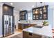 Kitchen featuring quartz countertops, stainless steel appliances, and dark wood cabinets at 944 Cherokee Se Ave, Atlanta, GA 30315