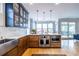 Modern kitchen with stainless steel appliances, center island, quartz countertops and hardwood floors at 944 Cherokee Se Ave, Atlanta, GA 30315