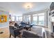 Bright living room with hardwood floors, fireplace, and access to a private balcony at 944 Cherokee Se Ave, Atlanta, GA 30315