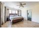 Spacious main bedroom with light-filled windows and hardwood floors at 944 Cherokee Se Ave, Atlanta, GA 30315