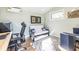 A modern office setup with light green walls, a desk, a futon, and a decorative rug at 944 Cherokee Se Ave, Atlanta, GA 30315