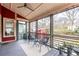 Serene screened porch features a cozy seating area and backyard views, perfect for relaxation and outdoor enjoyment at 944 Cherokee Se Ave, Atlanta, GA 30315