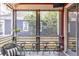 Cozy screened porch with outdoor seating and neighborhood views, perfect for relaxation and entertainment at 944 Cherokee Se Ave, Atlanta, GA 30315