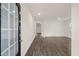 Bright open-concept living space featuring wood-look floors and a glass paneled front door at 1038 Blue Juniper Cir, Loganville, GA 30052