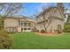 Expansive backyard with lush green grass, mature trees, and a multi-level deck area at 15 Northwood Ne Ave, Atlanta, GA 30309