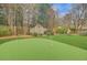 Private backyard featuring a putting green and lush landscaping at 15 Northwood Ne Ave, Atlanta, GA 30309