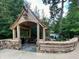 Brookwood Hills Community Club entrance with beautiful stone and wooden pergola and bench seating at 15 Northwood Ne Ave, Atlanta, GA 30309