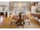 Dining room featuring a chandelier, large windows, and hardwood flooring at 15 Northwood Ne Ave, Atlanta, GA 30309