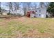 Large backyard with a red wood deck and stairs attached to the blue house at 1707 Terry Mill Road Se Rd, Atlanta, GA 30316