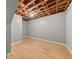 Unfinished basement with wooden floors and exposed ceiling beams at 1707 Terry Mill Road Se Rd, Atlanta, GA 30316