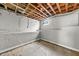 Unfinished basement with concrete wall and exposed ceiling beams at 1707 Terry Mill Road Se Rd, Atlanta, GA 30316