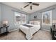 Cozy bedroom with a ceiling fan, and two windows offering natural light at 1707 Terry Mill Se Rd, Atlanta, GA 30316