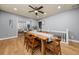 Open dining room featuring hardwood floors and a modern table with seating for six at 1707 Terry Mill Se Rd, Atlanta, GA 30316