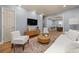 Bright living room with hardwood floors, modern furniture, and an open floor plan at 1707 Terry Mill Se Rd, Atlanta, GA 30316