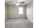 Bedroom with gray carpet, neutral walls, a ceiling fan, and a window for natural light at 2724 Hickory Smoke Ct, Snellville, GA 30078