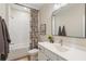 Bathroom featuring a shower-tub combo, white vanity, and a decorative floral shower curtain at 508 Boardwalk Way, Alpharetta, GA 30022