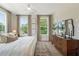 Bedroom featuring large windows, wooden floors, modern ceiling fan and stylish decor at 508 Boardwalk Way, Alpharetta, GA 30022