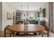 Charming eat-in kitchen with sage cabinets, a kitchen island, and lovely pendant lighting above the island at 508 Boardwalk Way, Alpharetta, GA 30022