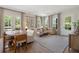 Bright living room featuring lots of windows, wood floors, a neutral color palette, and modern furnishings at 508 Boardwalk Way, Alpharetta, GA 30022