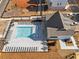 Aerial view of a community pool with lounge chairs and a modern pergola, perfect for relaxation at 508 Boardwalk Way, Alpharetta, GA 30022