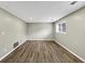 Finished basement featuring modern wood flooring, neutral paint, and recessed lighting for a bright, welcoming space at 847 Magna Carta Nw Dr, Atlanta, GA 30318