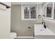 The bathroom features a sleek vanity, modern fixtures, with a neutral color palette that creates a soothing ambiance at 847 Magna Carta Nw Dr, Atlanta, GA 30318