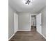 This room features modern lighting, neutral paint, wood-look flooring, and a closet at 847 Magna Carta Nw Dr, Atlanta, GA 30318