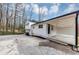 Charming two-story home with white siding and covered parking at 847 Magna Carta Nw Dr, Atlanta, GA 30318