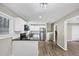 Modern kitchen with stainless steel appliances, white cabinets, and sleek black countertops at 847 Magna Carta Nw Dr, Atlanta, GA 30318