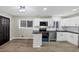 Modern kitchen features stainless steel appliances, white cabinets, and dark countertops at 847 Magna Carta Nw Dr, Atlanta, GA 30318