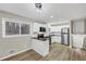 Kitchen with stainless steel appliances, white cabinets, and bar with pendant lighting at 847 Magna Carta Nw Dr, Atlanta, GA 30318