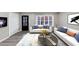 Cozy living room with modern white couches, accent pillows, and stylish rug at 847 Magna Carta Nw Dr, Atlanta, GA 30318