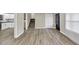 This spacious living room offers hardwood floors, leading to the kitchen and staircase at 847 Magna Carta Nw Dr, Atlanta, GA 30318