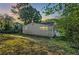 Spacious backyard offering a private outdoor space with mature trees and natural surroundings at 1383 Almont Sw Dr, Atlanta, GA 30310