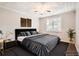 Comfortable staged bedroom with neutral tones, ample natural light and stylish accents at 1383 Almont Sw Dr, Atlanta, GA 30310